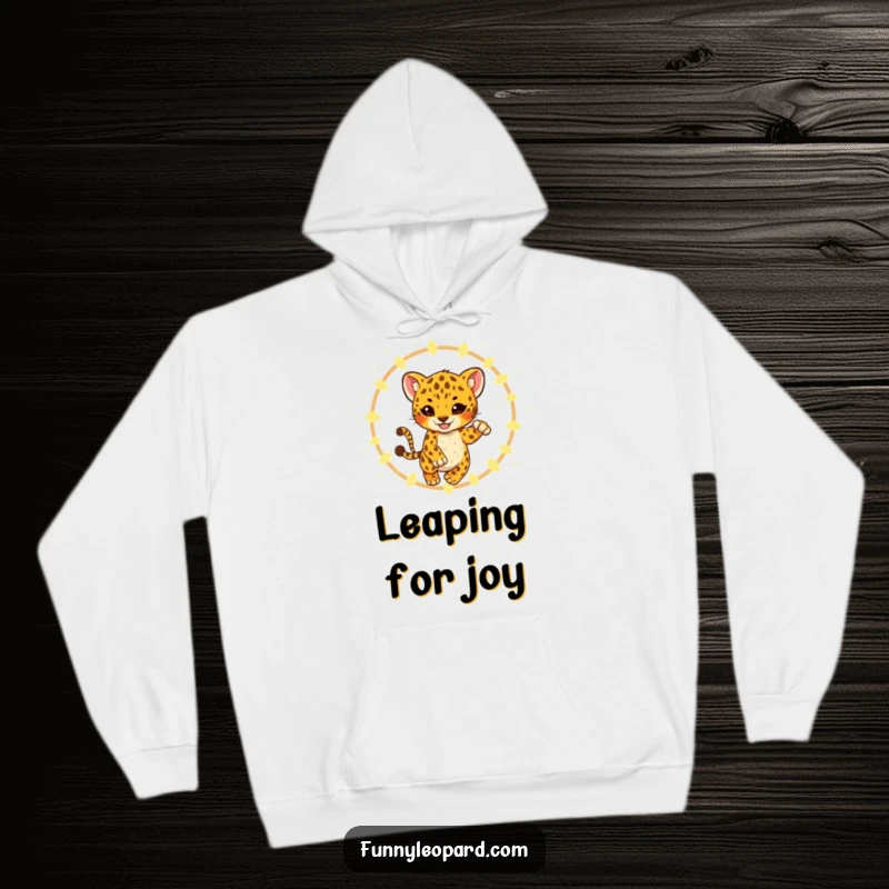 Funny Hoodie featuring a playful leopard cub leaping through a magical ring of glowing fireflies, offering warmth and enchantment.