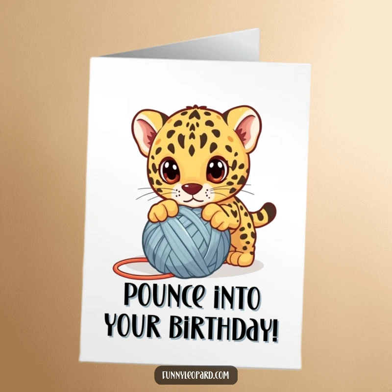 Funny Free Printable Birthday Card: A cute leopard cub with big eyes playfully pounces on a ball of yarn.