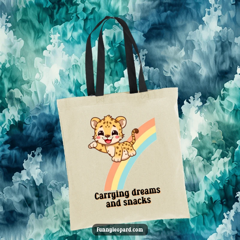 Funny Tote Bag featuring a cheerful leopard with a happy grin sliding down a rainbow, perfect for carrying goodies with style and humor.