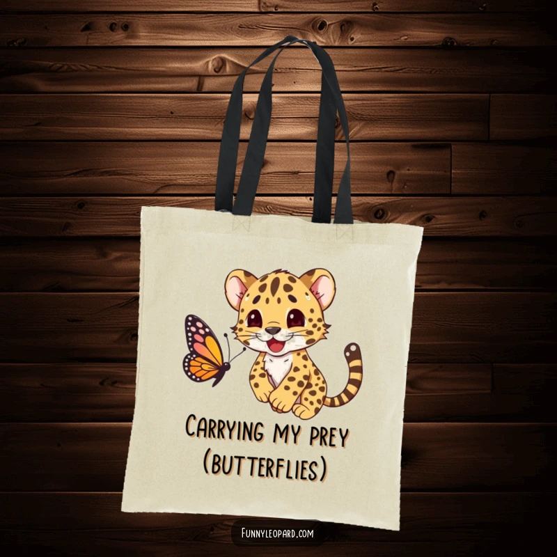 Funny tote bag illustrating a happy leopard cub character mid-pounce on a butterfly, showcasing playful innocence and fun.