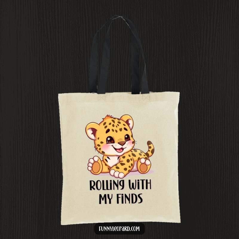 Funny tote bag displaying a playful leopard cub cub rolling around happily with a wide, joyful grin.